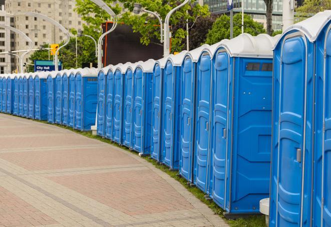 colorful portable restrooms available for rent at a local fair or carnival in Aventura FL